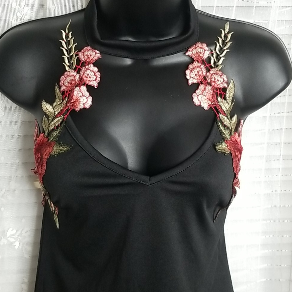 Black Floral Halter One Piece Body Suit Sz L fits more like a medium